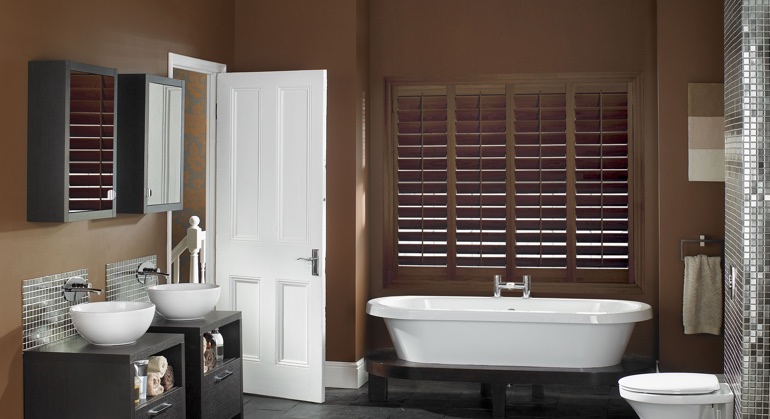 Stained wood shutter in New Brunswick restroom